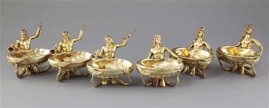 A handsome set of six Victorian cast silver gilt tables table salts three modelled as Neptune & Triton